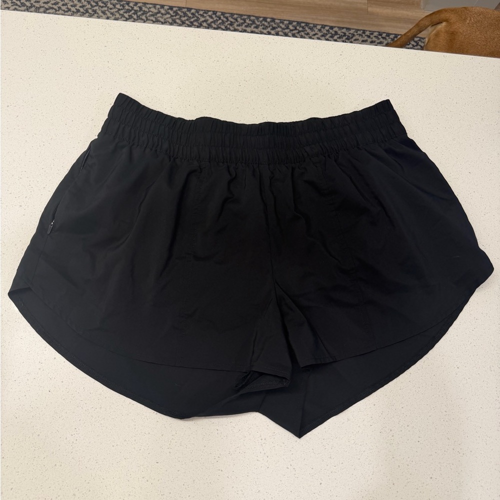all in motion Women's Woven Mid-Rise Run Shorts